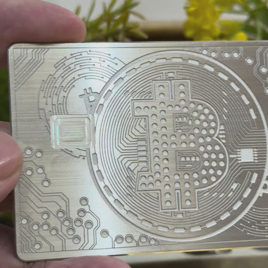 Elegant silver metal Bitcoin card with modern minimalist design