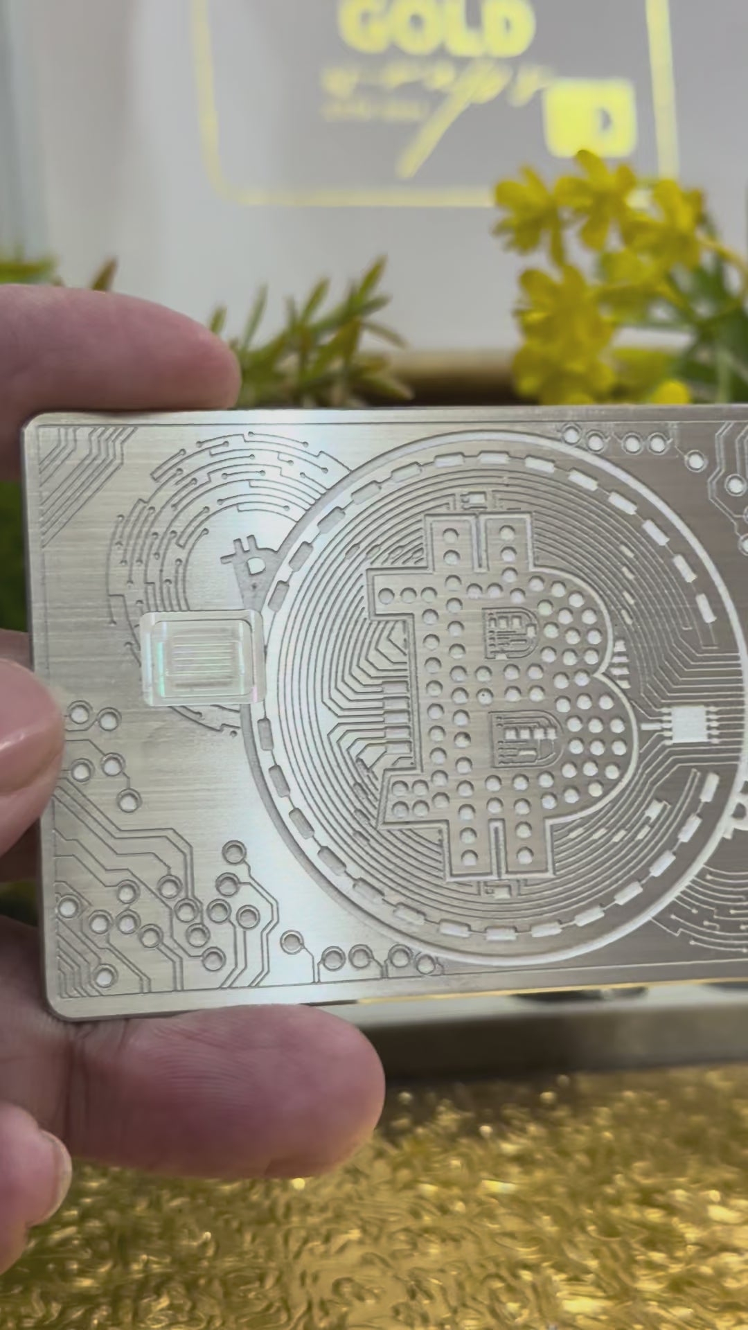Elegant silver metal Bitcoin card with modern minimalist design
